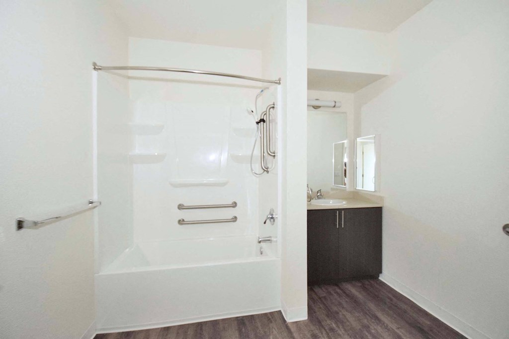 a bathroom with a bathtub and a sink