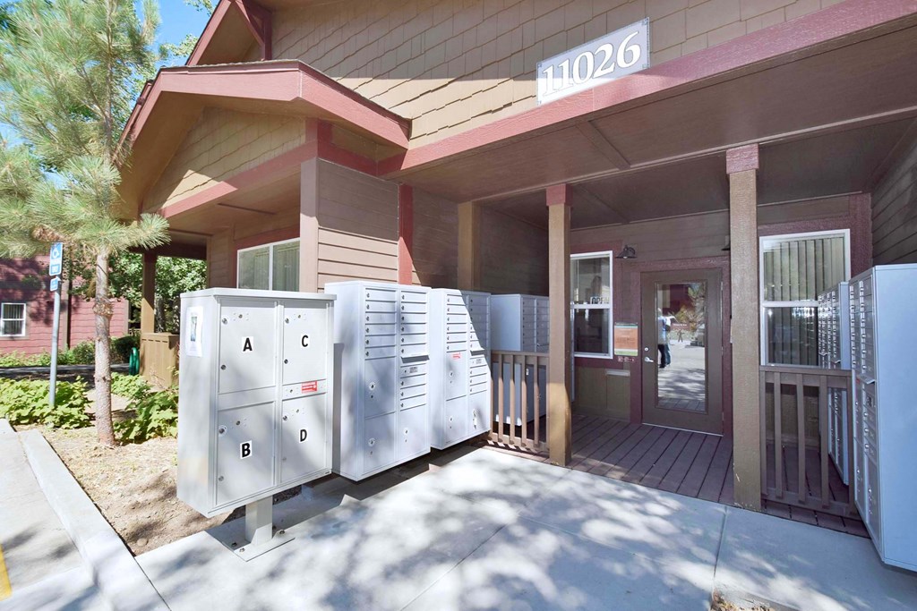 two refrigerators parked outside of a building