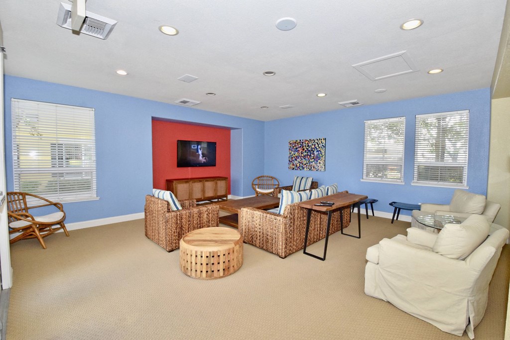 a living room with a couch and a table and a television