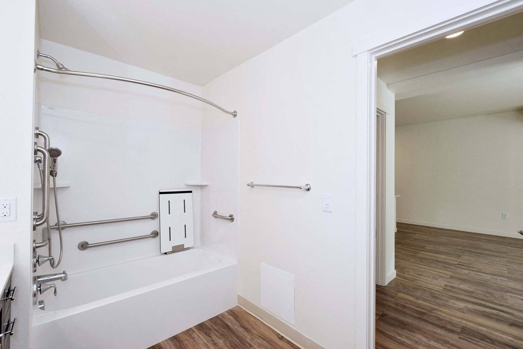 a empty room with a white wall and a walk in closet