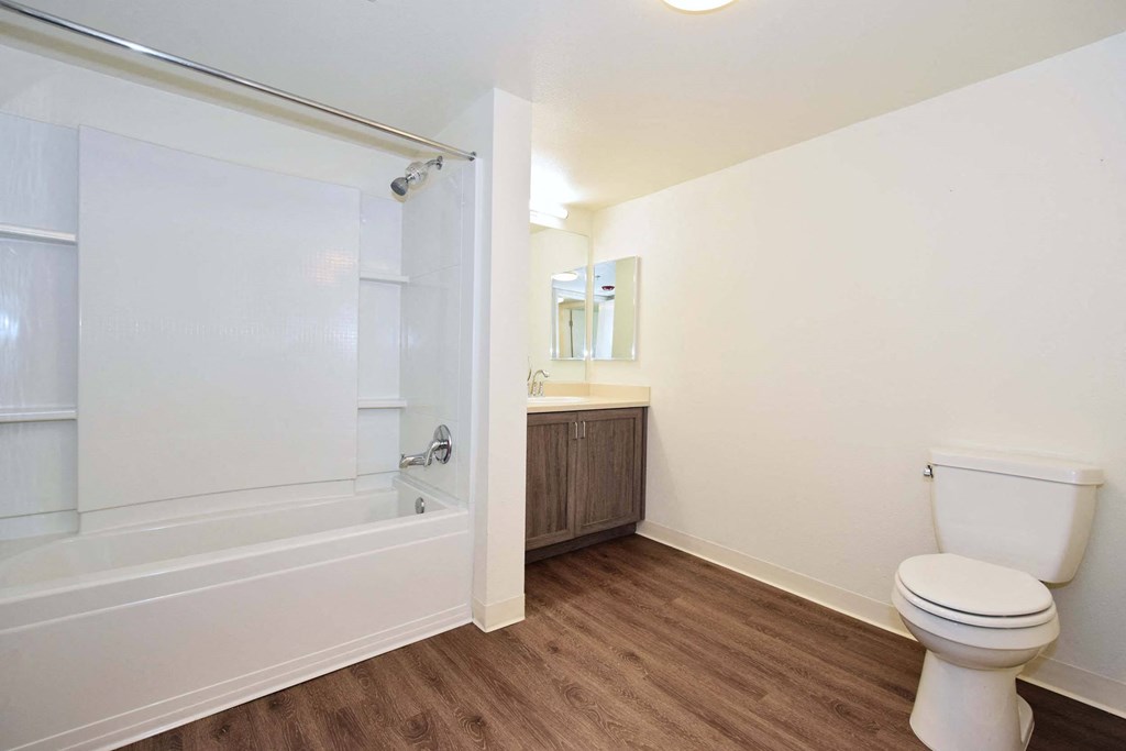 a bathroom with a toilet sink and bathtub