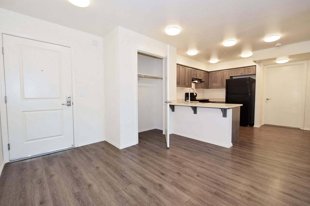 a kitchen and living room in a 555 waverly unit