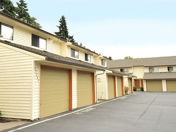 a row of garage doors on the side of a building