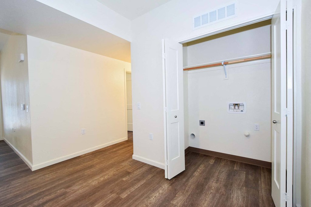 a bedroom with a closet and a sliding door