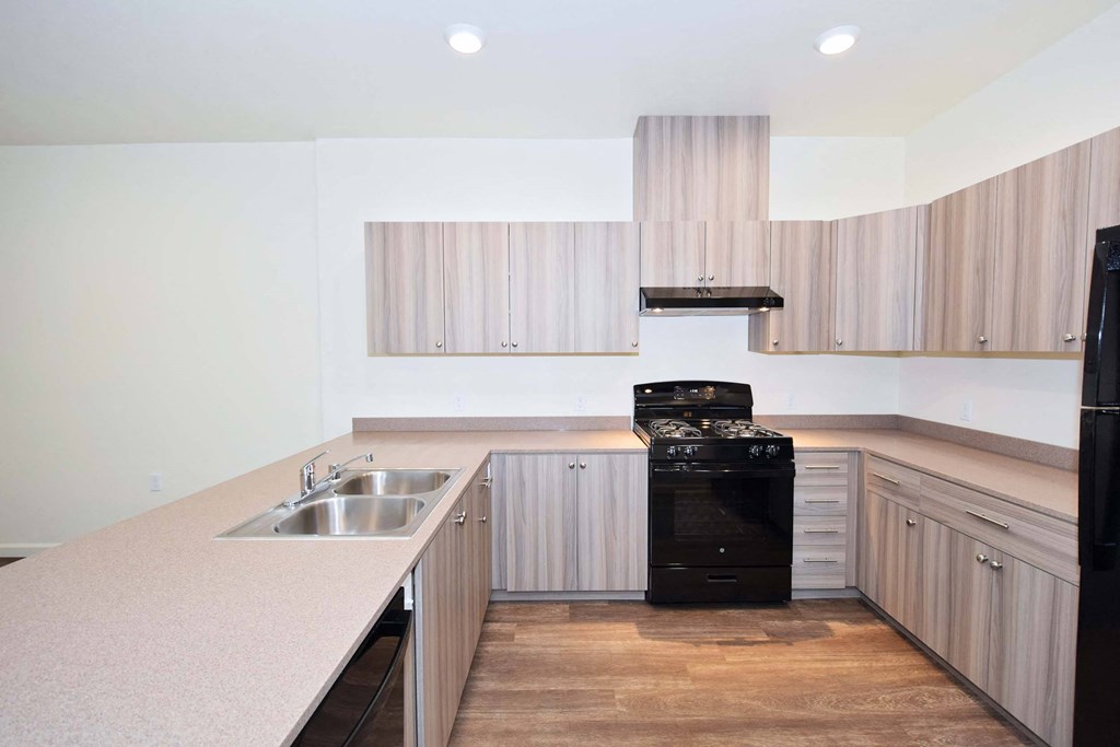 a kitchen with wooden cabinets and a sink