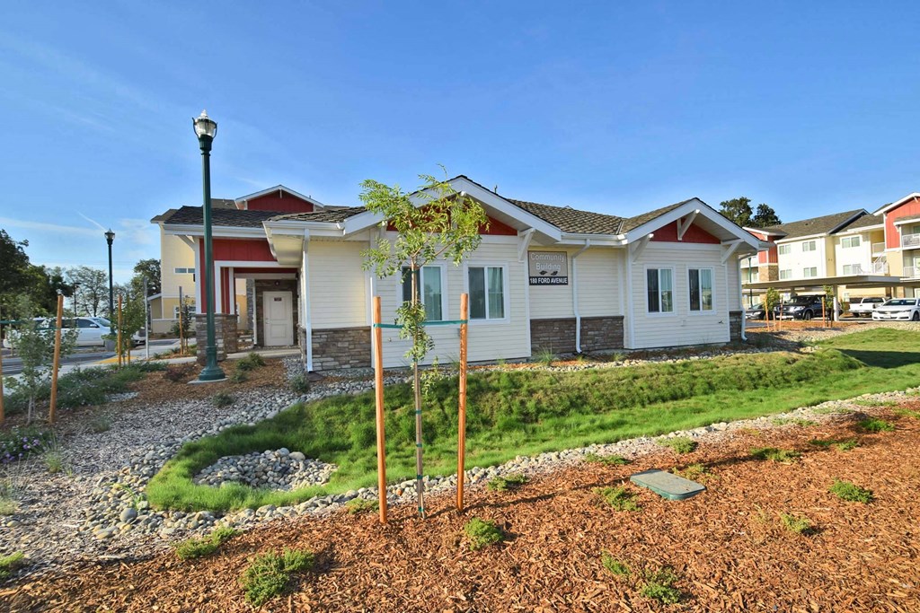 a house with a yard and a street in front of it