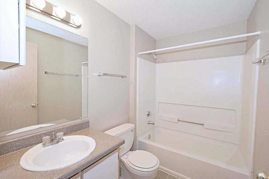 a bathroom with a sink toilet and a shower