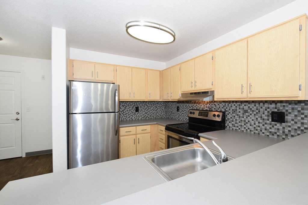 the preserve at ballantyne commons apartment kitchen with stainless steel appliances