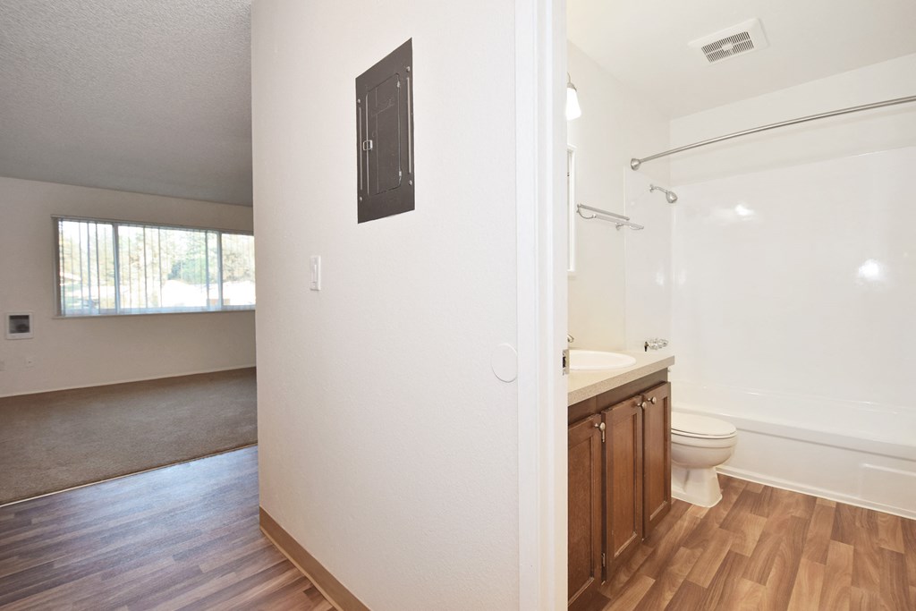 a bathroom with a toilet and a sink in a house