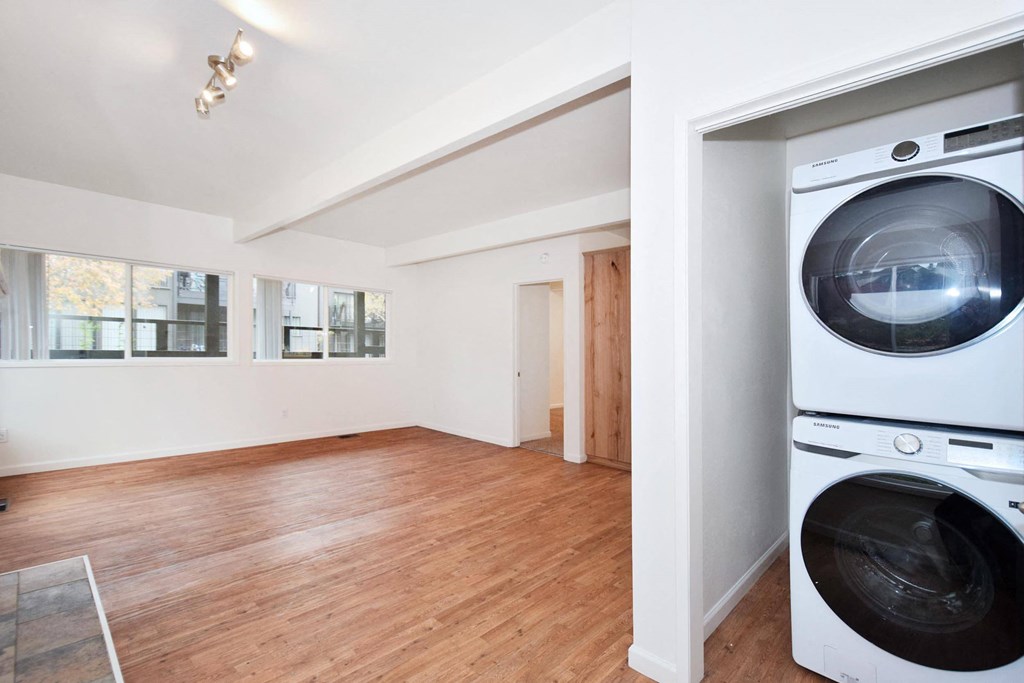 a laundry room with a washer and a dryer in it