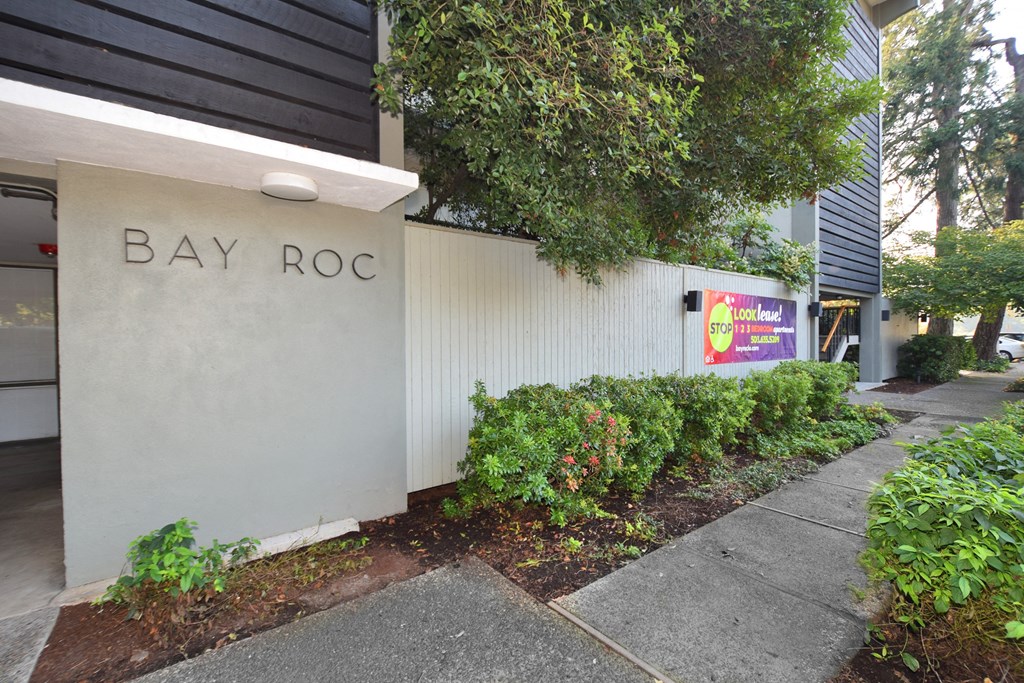 the exterior of bay rocco with a white wall and plants