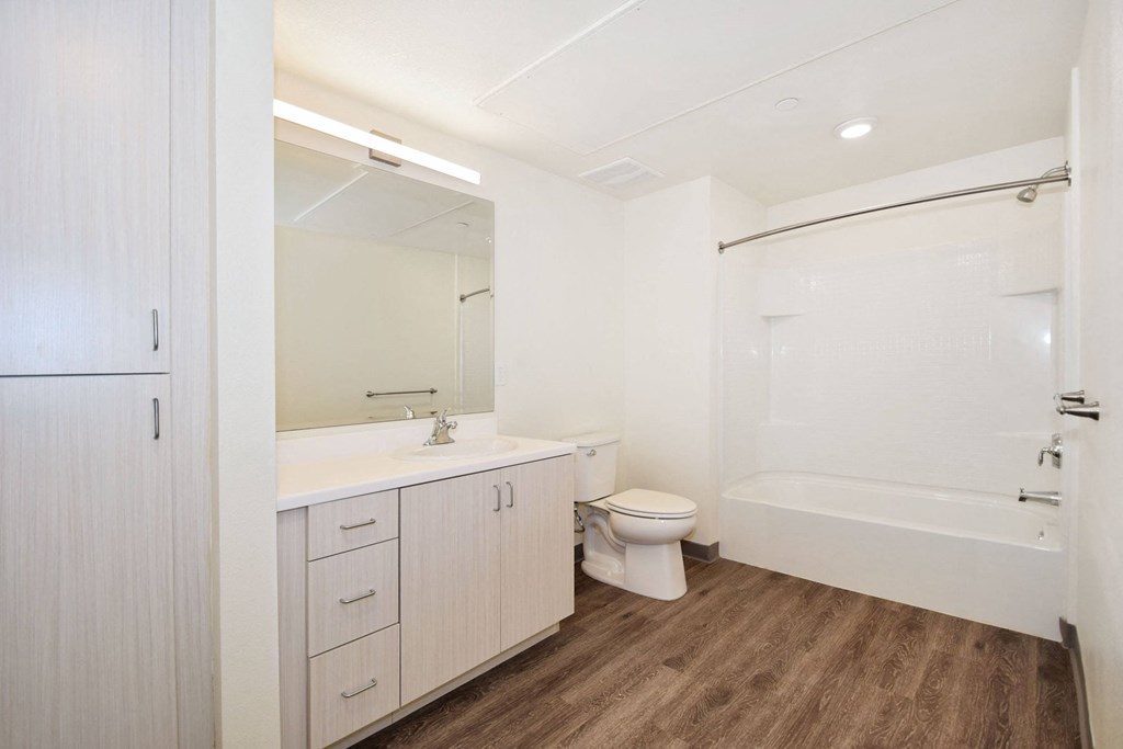 a bathroom with a toilet sink and a shower