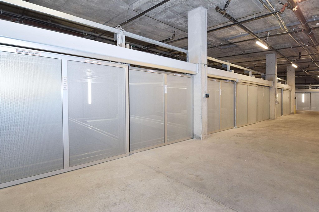 a row of stainless steel doors in a warehouse