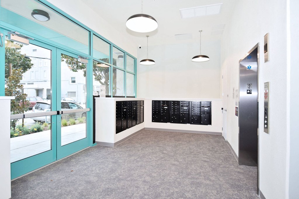 a hallway with blue doors and a door to a filing cabinet