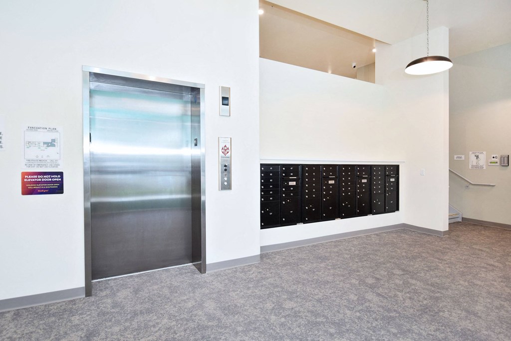a door to a room with a filing cabinet in the wall