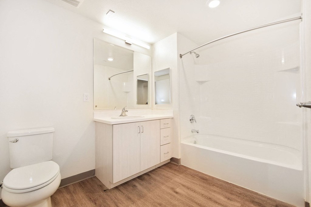 a bathroom with a sink toilet and a shower