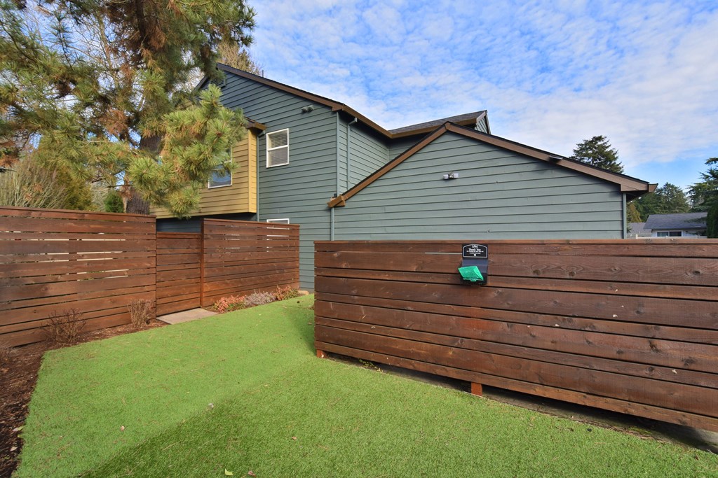 a wooden fence in front of a house