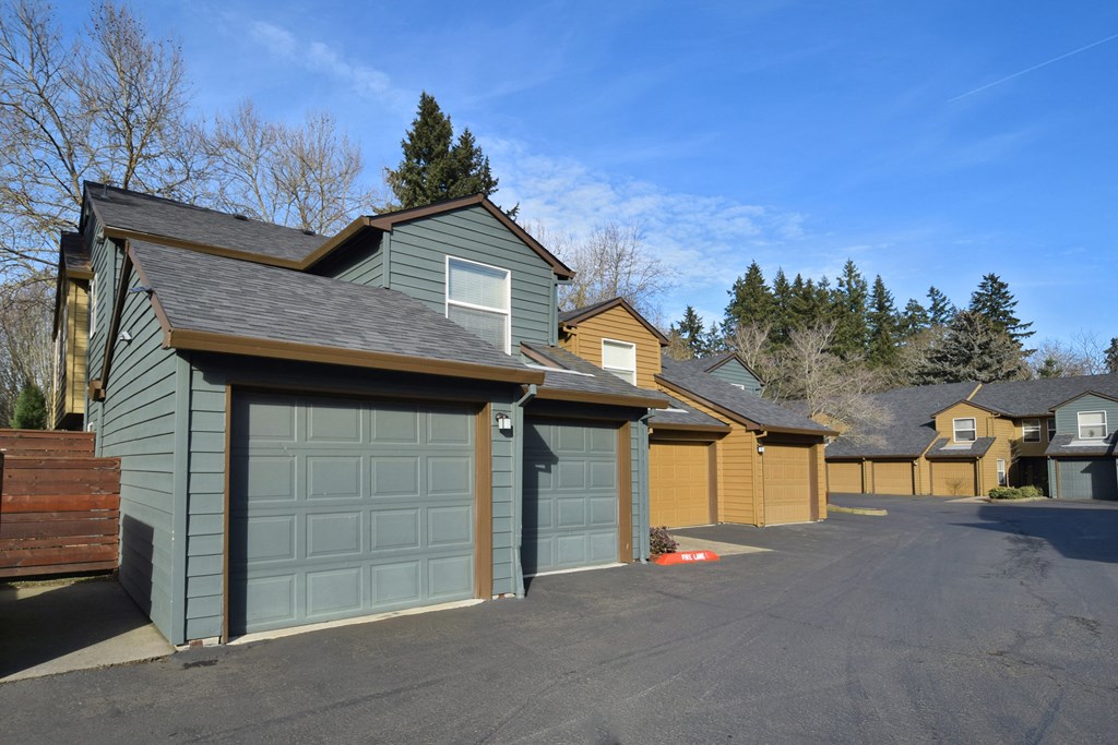 a row of garage doors on the side of a house