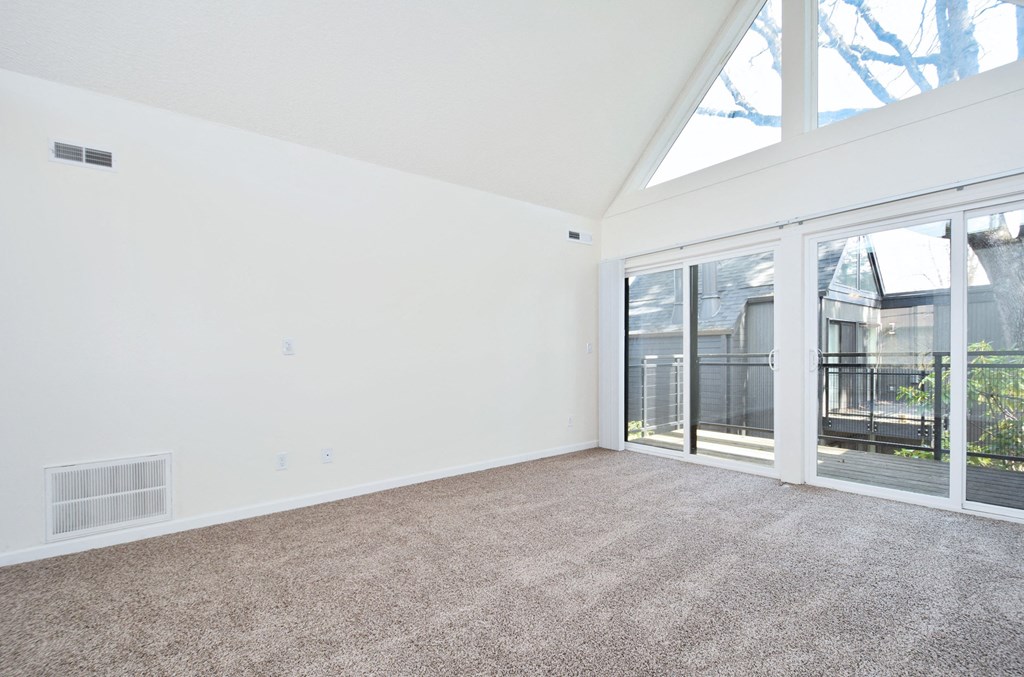 Timberwood Beaverton:  a living room with white walls and carpet