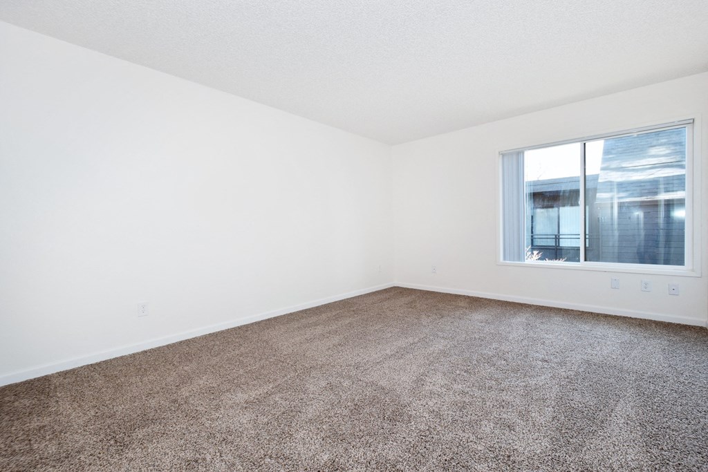 Timberwood Beaverton:  a bedroom with white walls and carpet