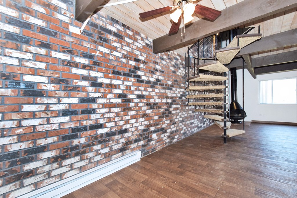 a brick accent wall in a living room