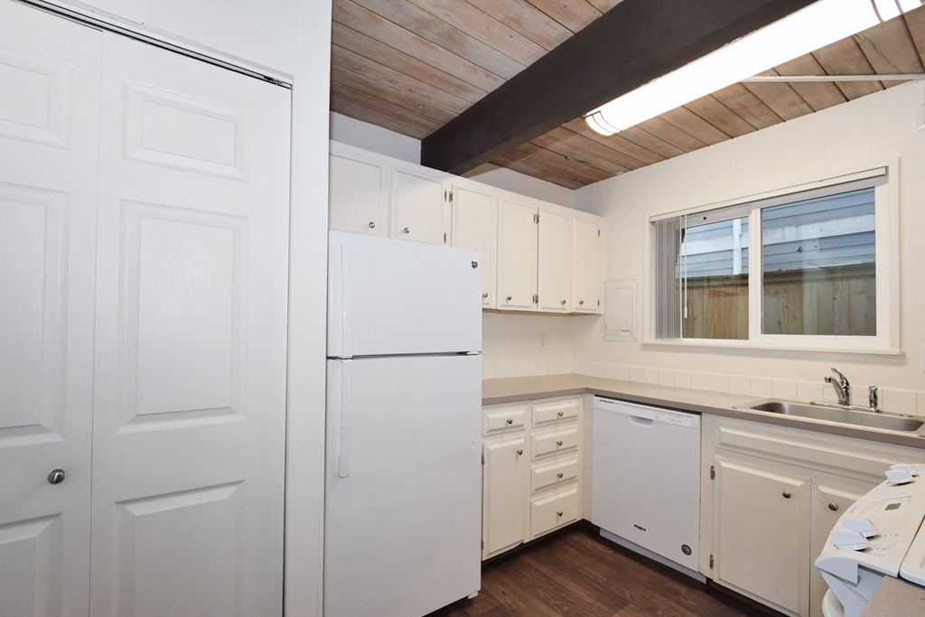 Menlo Manor: kitchen with white cabinets and white appliances