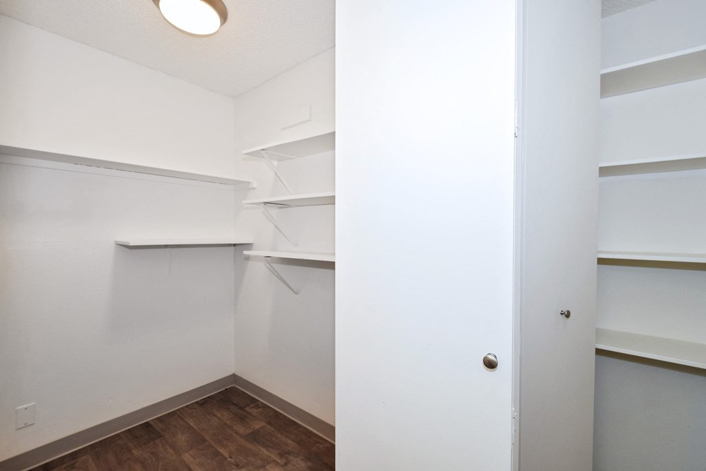 Menlo Manor:  bedroom with white walls and a wooden floor