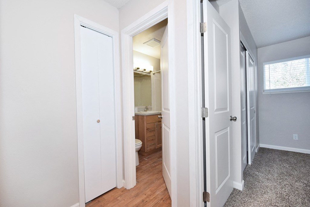 20th and Brooklyn  a hallway with two doors and a bathroom in the background