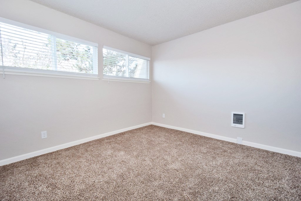 20th and Brooklyn  a bedroom with a carpeted floor and a large window