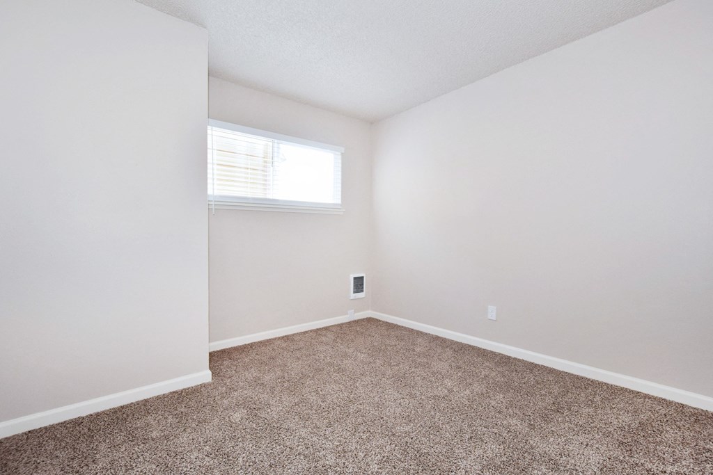 20th and Brooklyn  a bedroom with a carpeted floor and a window