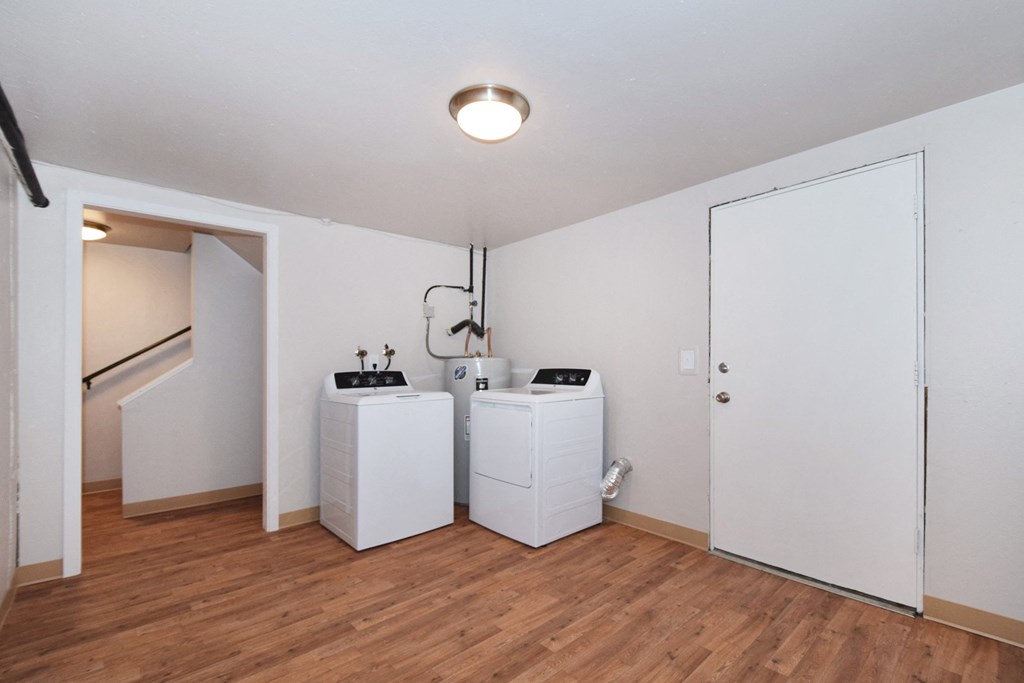 20th and Brooklyn  a laundry room with two washers and a dryer