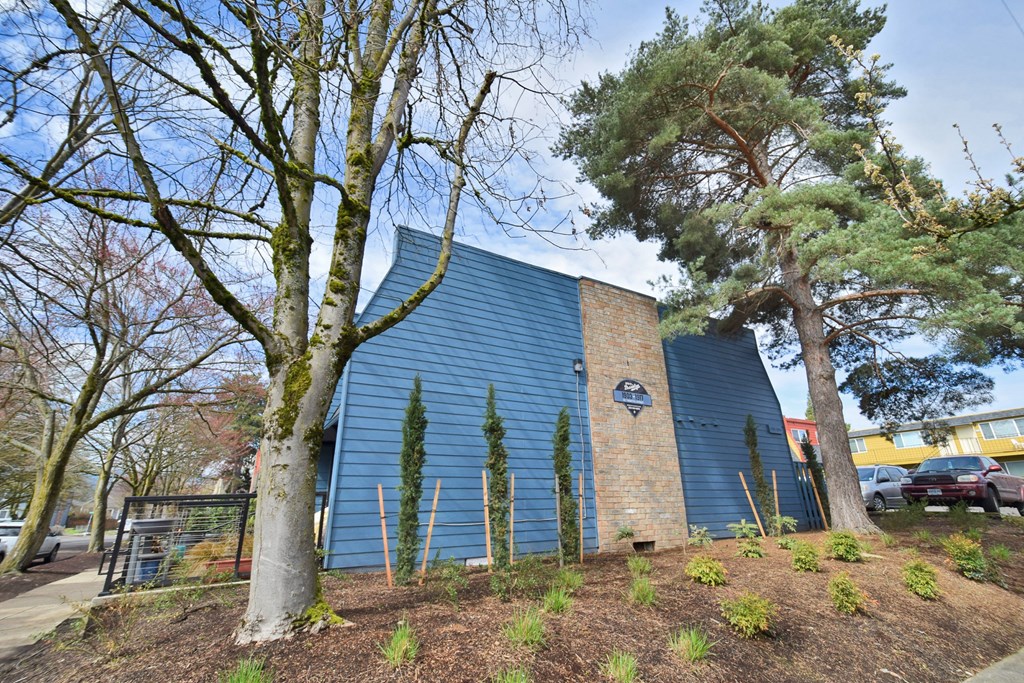 20th and Brooklyn  a blue building with trees in front of it