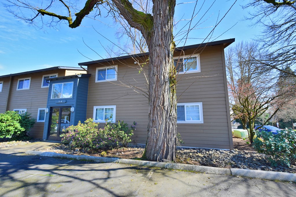 Crescent Ridge building with a large tree in front of it