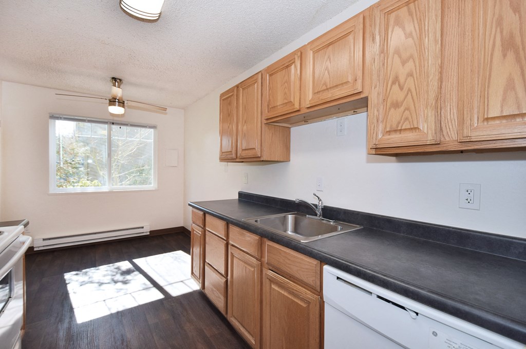 Crescent Ridge kitchen with wooden cabinets and a white dishwasher