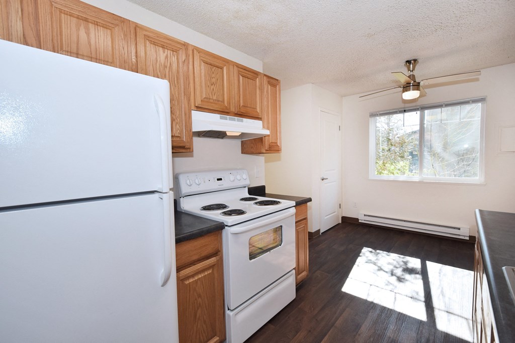 Crescent Ridge kitchen with white appliances and wooden cabinets