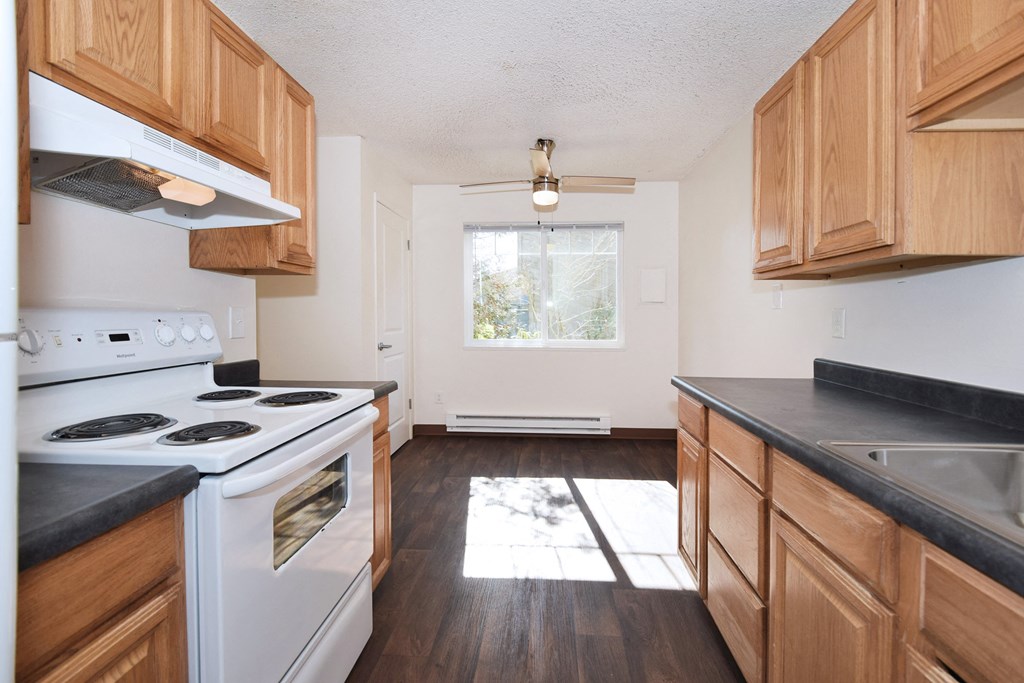 Crescent Ridge kitchen with wood cabinets and white appliances
