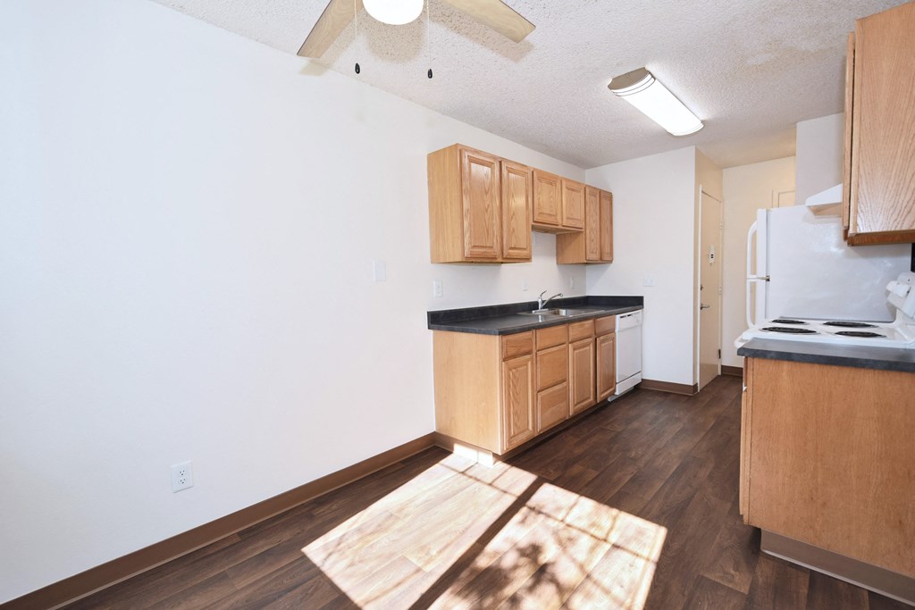 Crescent Ridge kitchen with wooden cabinets and a white refrigerator