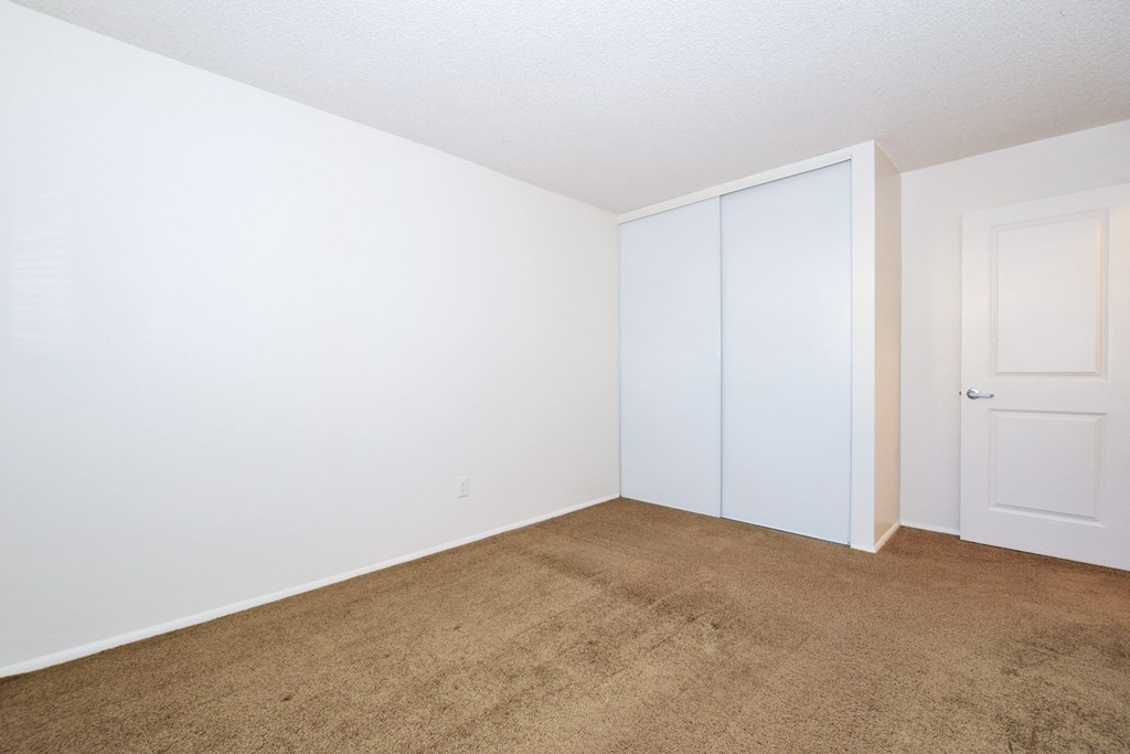 Crescent Ridge bedroom with a carpeted floor and white walls