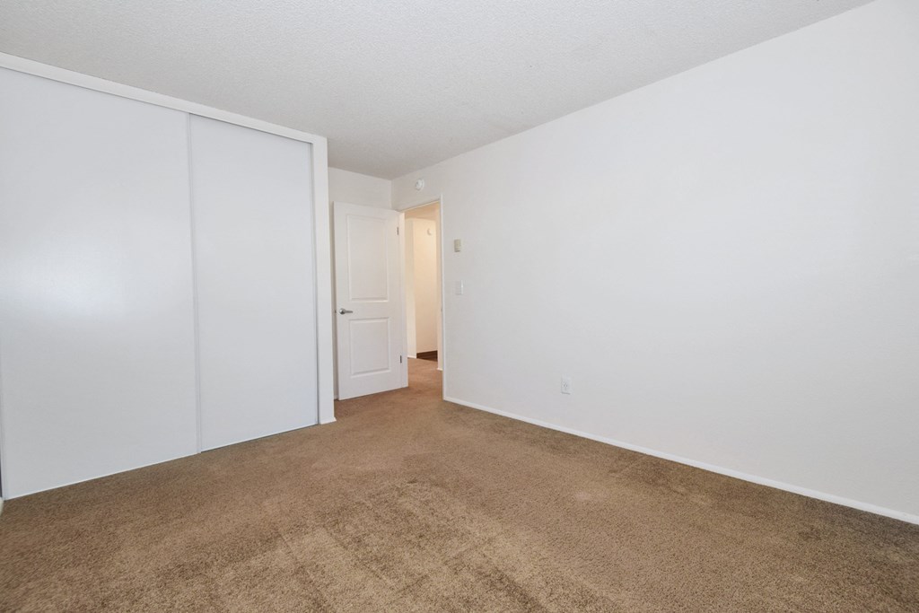Crescent Ridge bedroom with a carpeted floor and white walls