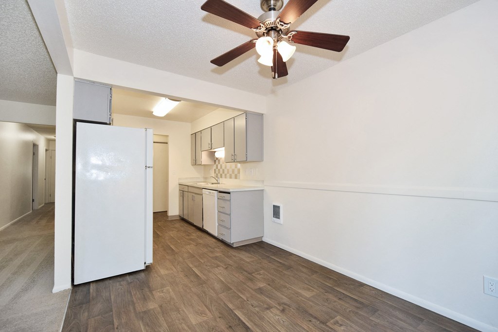 a kitchen and living room in a 555 waverly unit