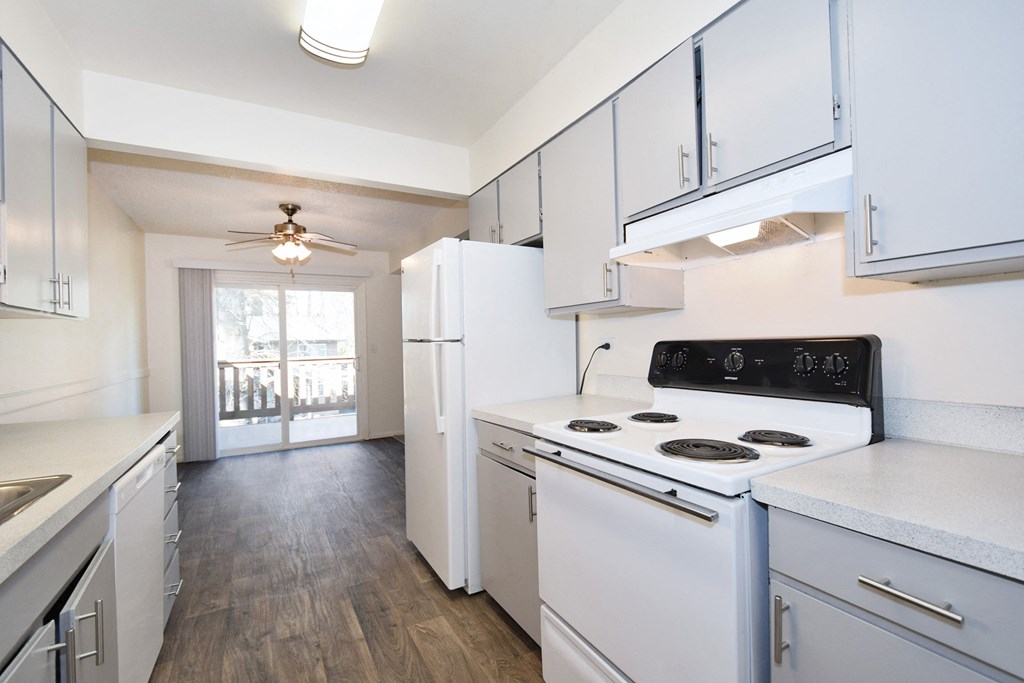 Birnam West: kitchen with white appliances and white cabinets