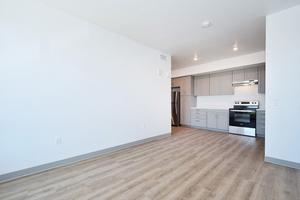 a bedroom with a medium sized bed and a window