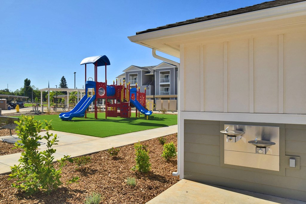 a playground at the whispering winds apartments in pearland, tx