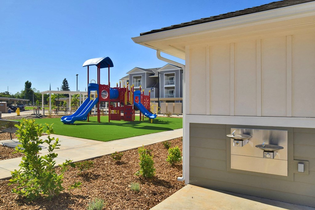 a playground at the whispering winds apartments in pearland, tx