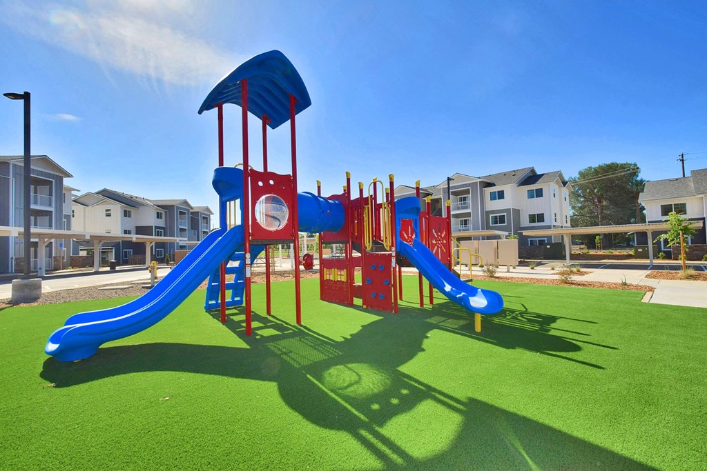 a playground at the flats at big tex apartments in san antonio, tx