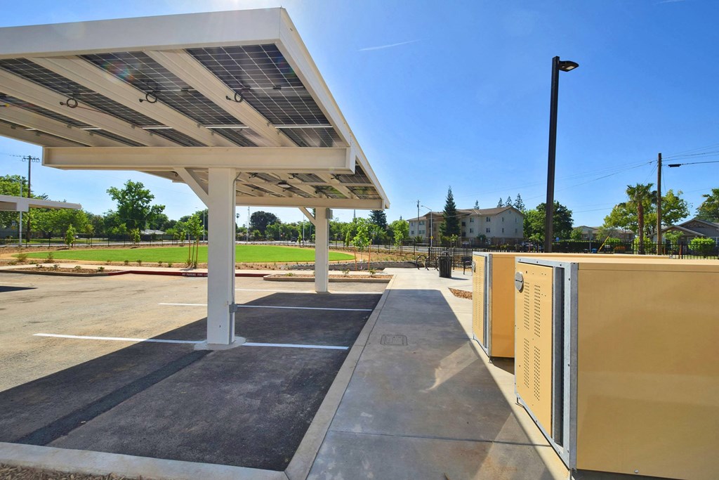 a gas station with solar panels on the roof