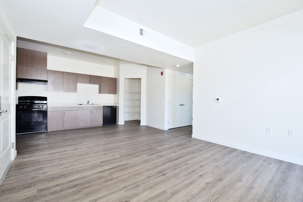 a kitchen and living room in a 555 waverly unit