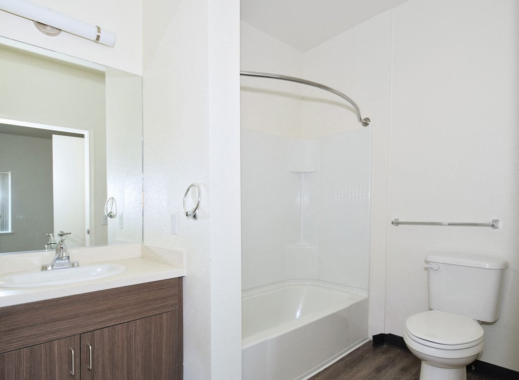 a bathroom with a toilet sink and bathtub