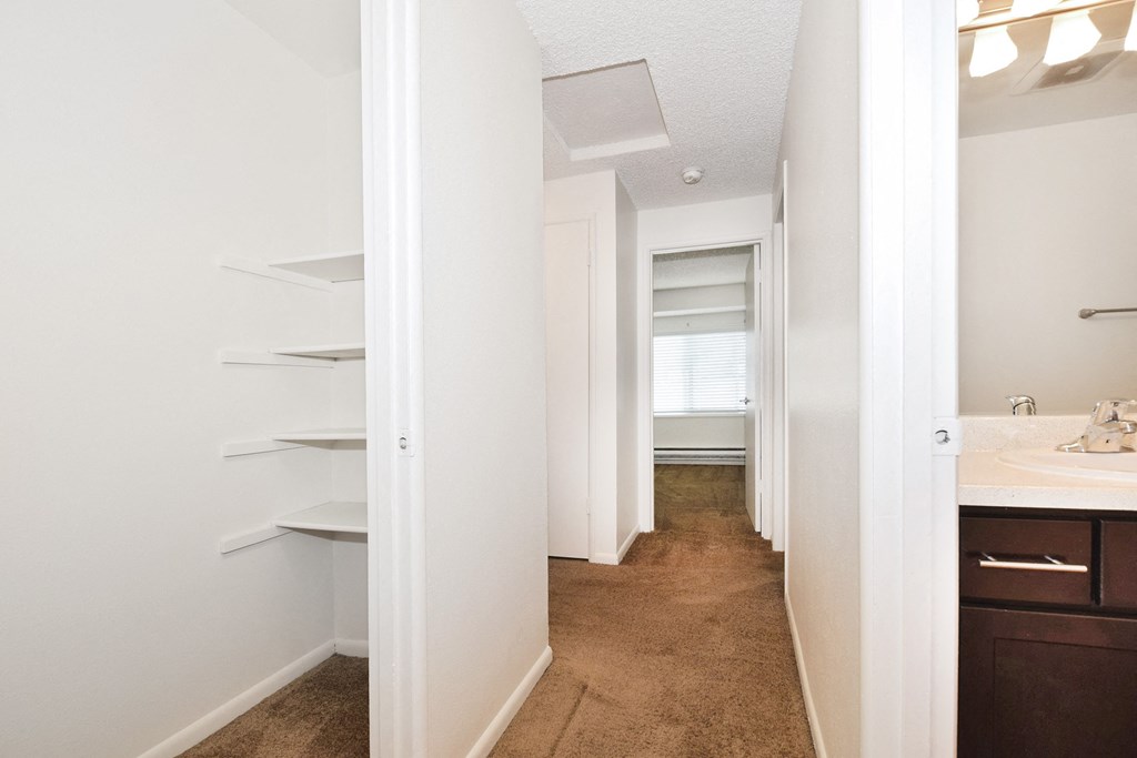 a walk in closet in a 555 waverly unit