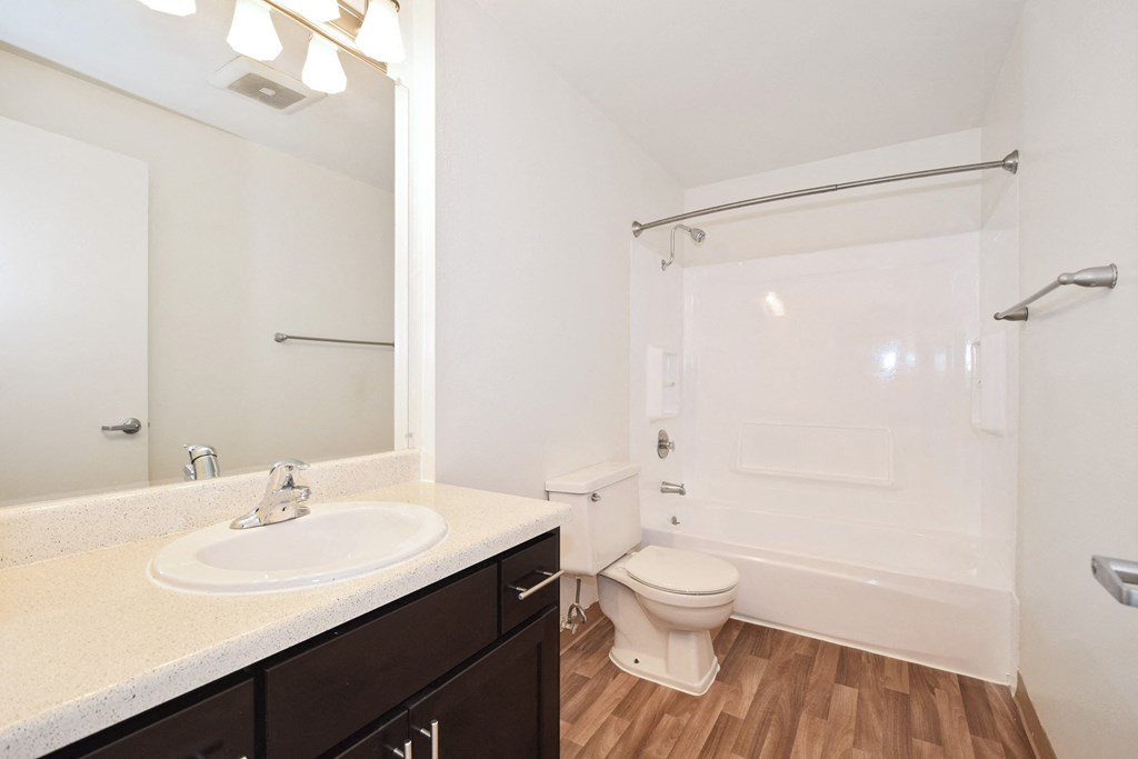 a bathroom with a toilet sink and bathtub